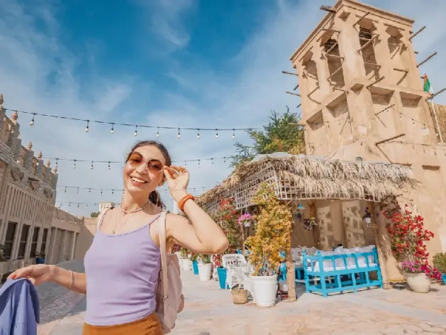Traveler exploring Al Fahidi and old Dubai.