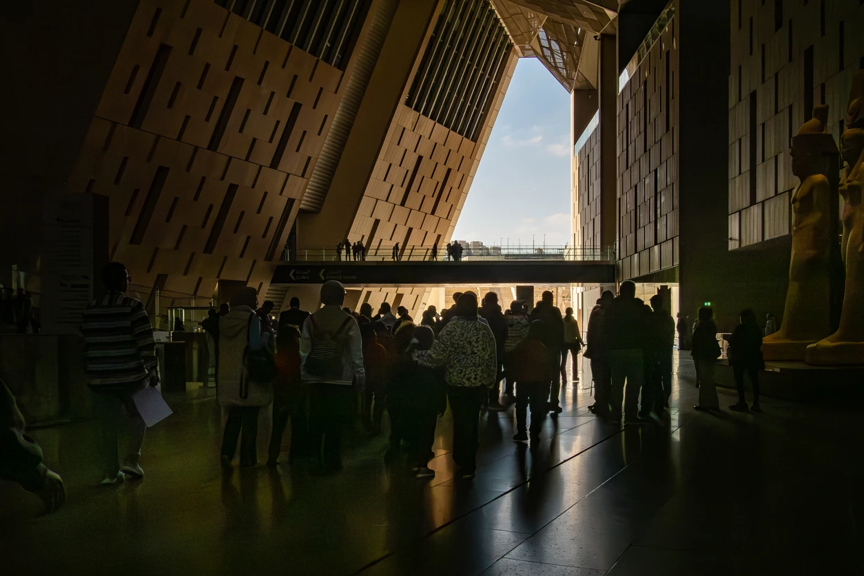 Tourist in interior of the Grand Egyptian Museum, Grand Egyptian Museum