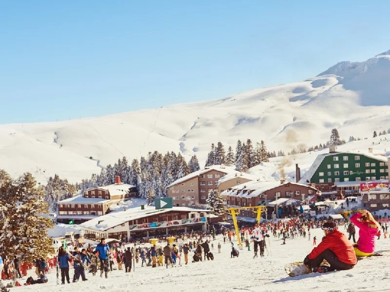 Skiing and snowboarding at Uludağ winter resort in Turkey.