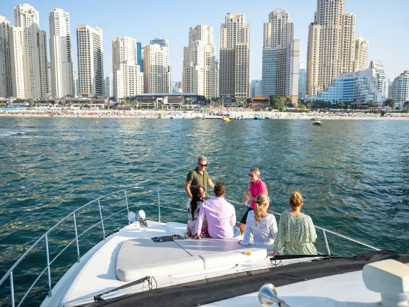 Group of friends relaxing on a yacht in Dubai.