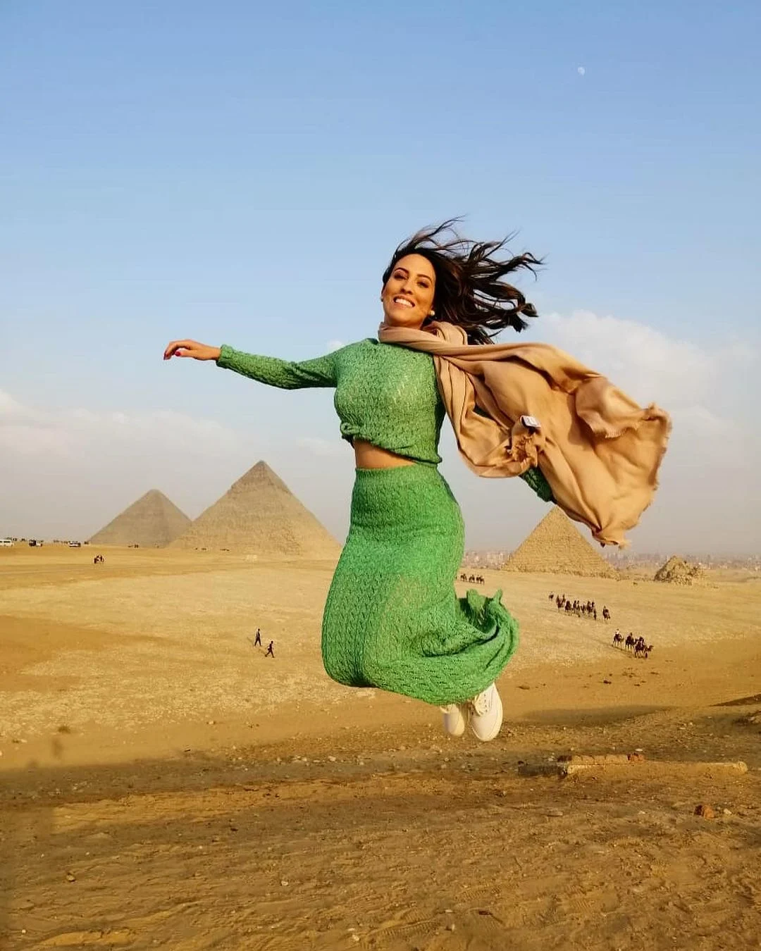 woman jumping infront of the pyramids, Cairo Tour