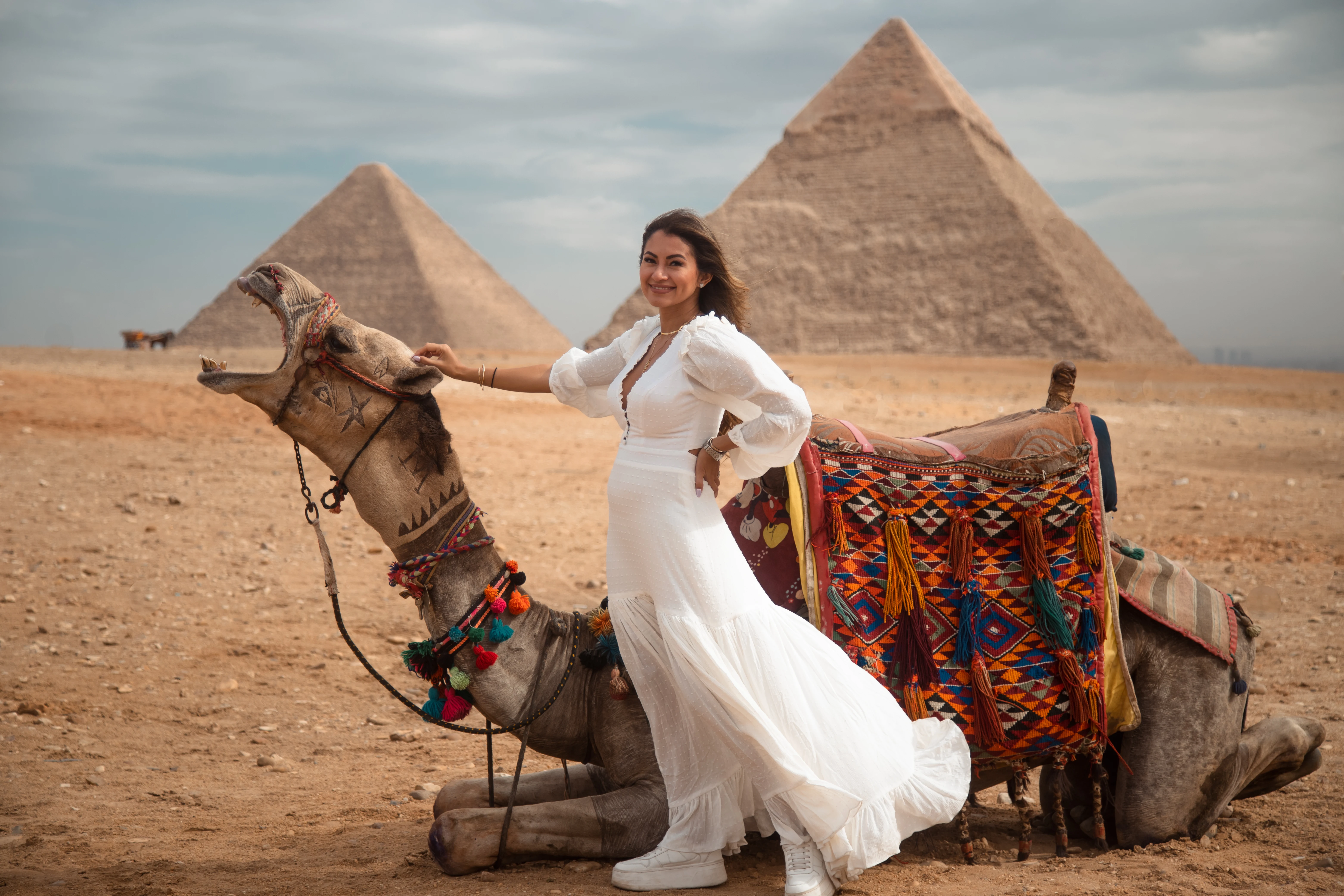 a woman with camel in front of the pyramids, Cairo and Nile Cruise Package: 9 Days from the Pyramids to the Valley of the Kings