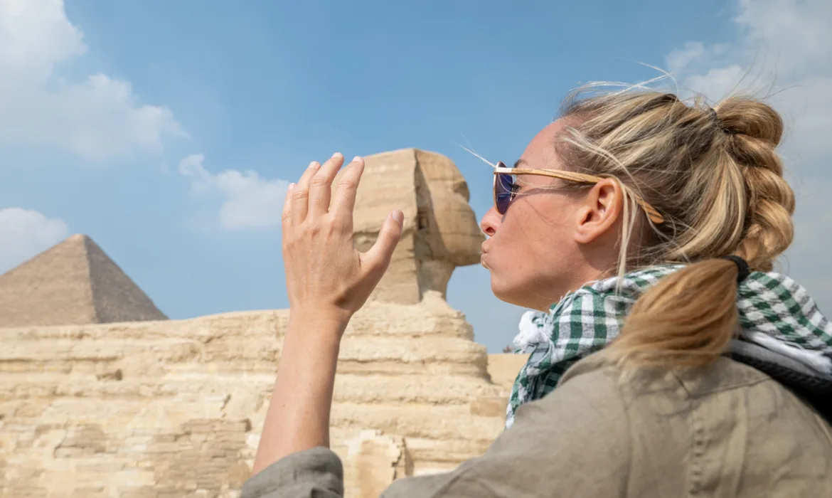 woman kissing the sphinx, Dahabiya Nile Cruise
