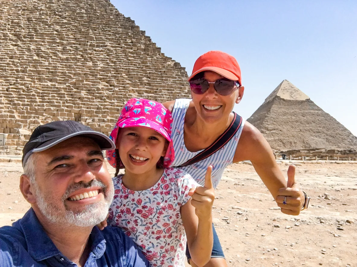 family enjoying visiting the pyramids of giza, Port Said to Cairo