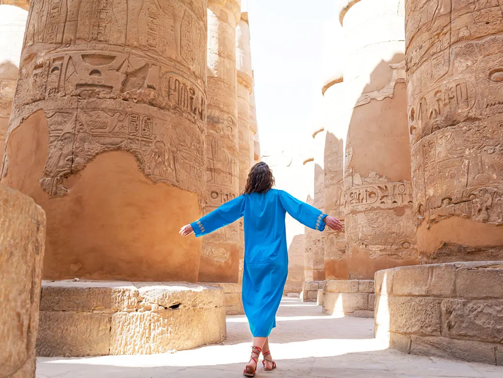 a tourist in the temples of luxor, Cairo and Luxor Tour by Sleeper Train