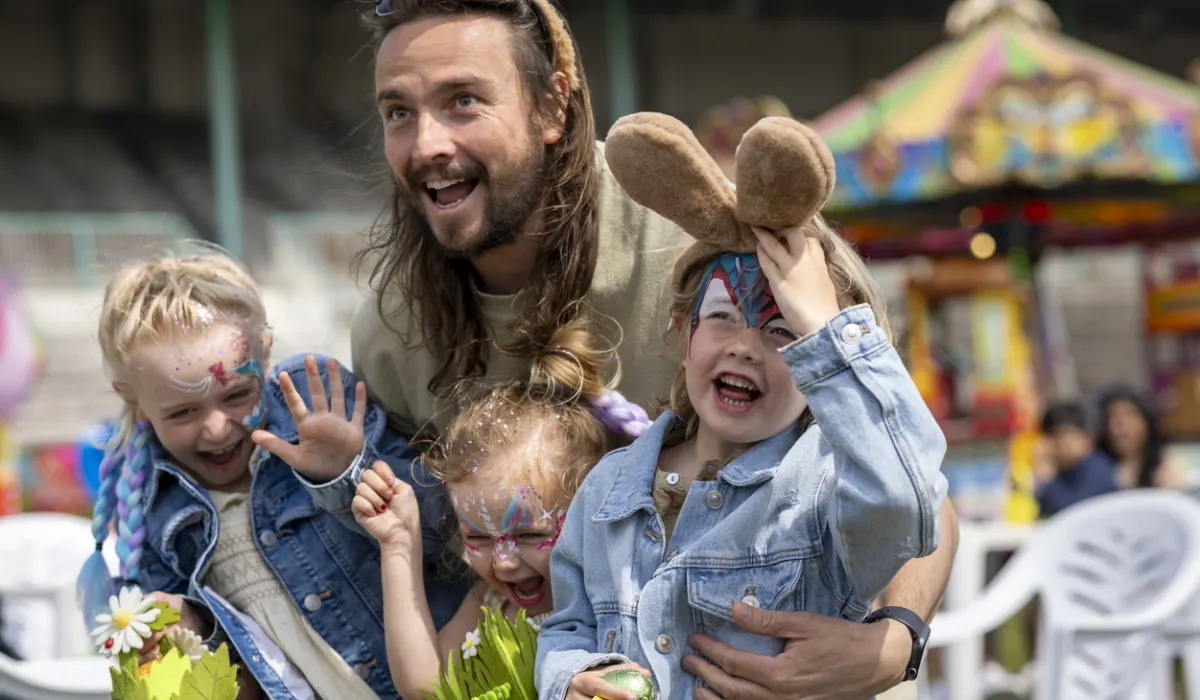 Excited kids with a father in Easter
