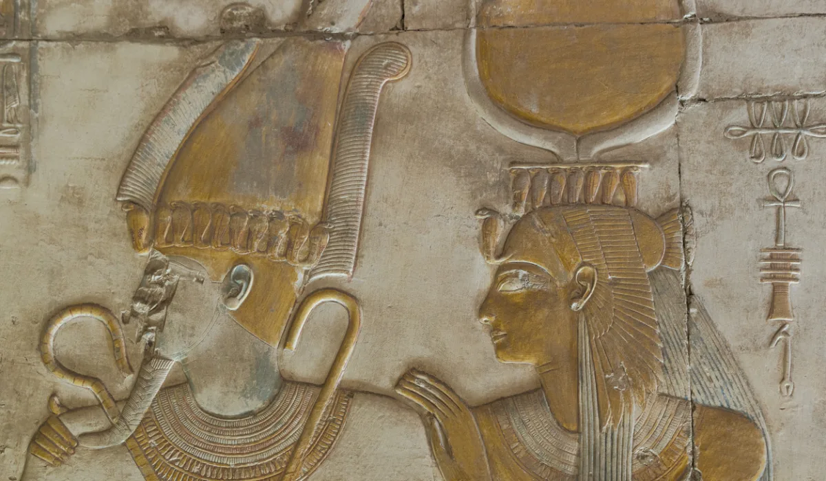 Isis standing behind Osiris at Abydos Temple