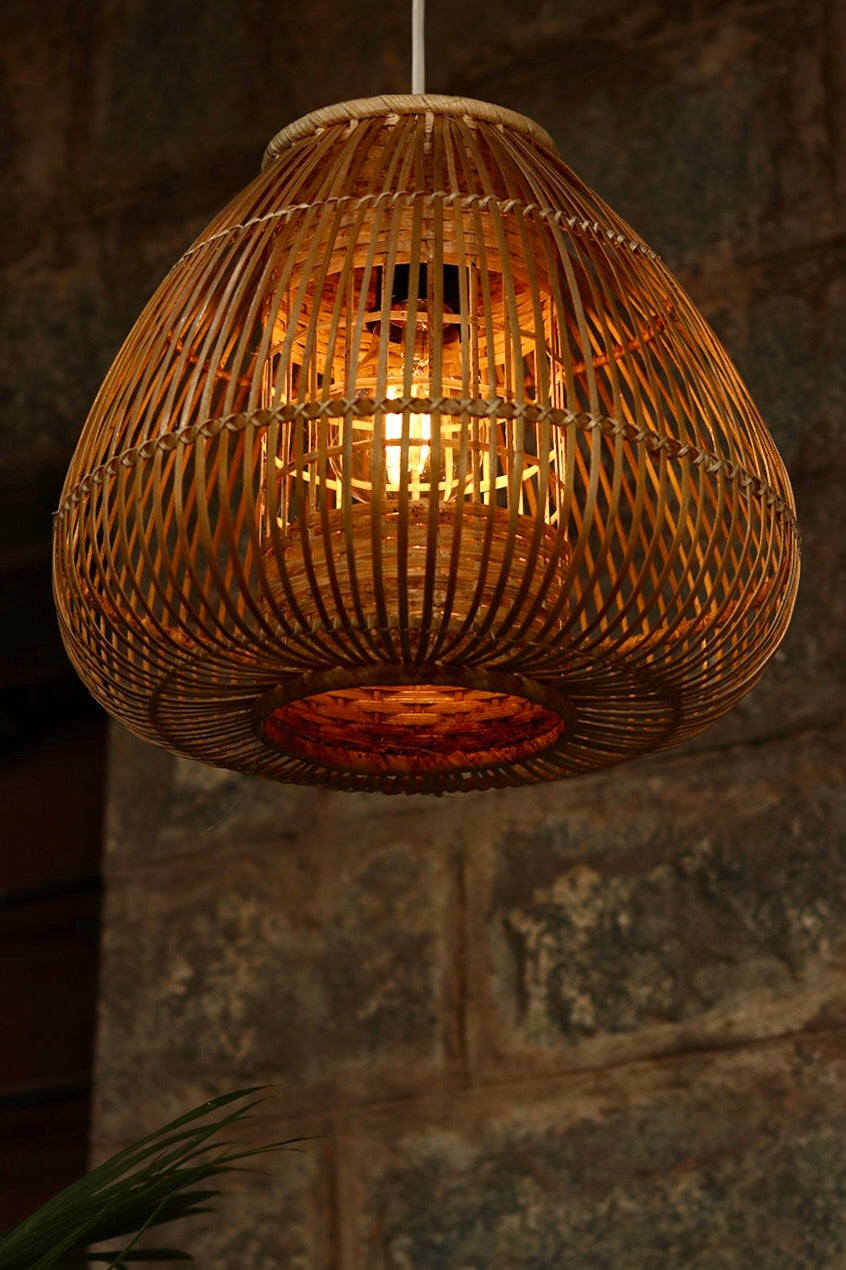 Teardrop Bamboo Pendant Lamp — hanging over a dining table