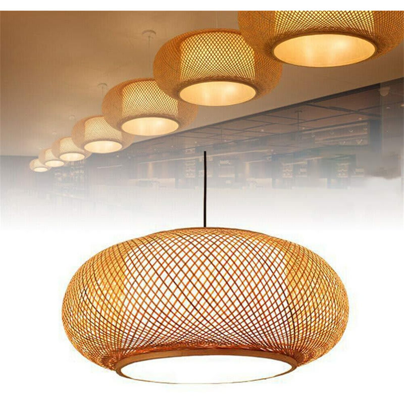 Welty Rustic Bamboo Rattan Lantern Pendant — hanging over a dining table