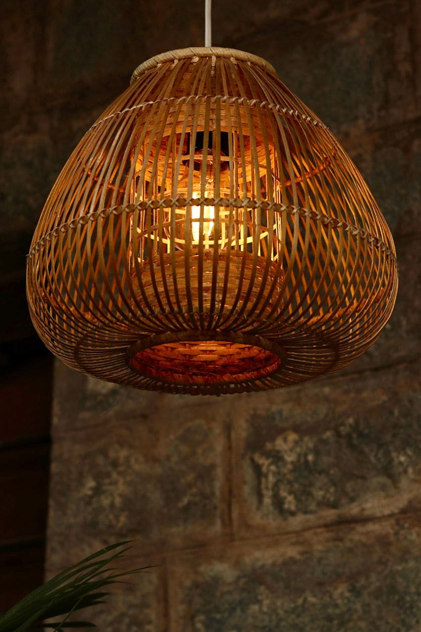 Teardrop Bamboo Pendant Lamp — hanging over a dining table