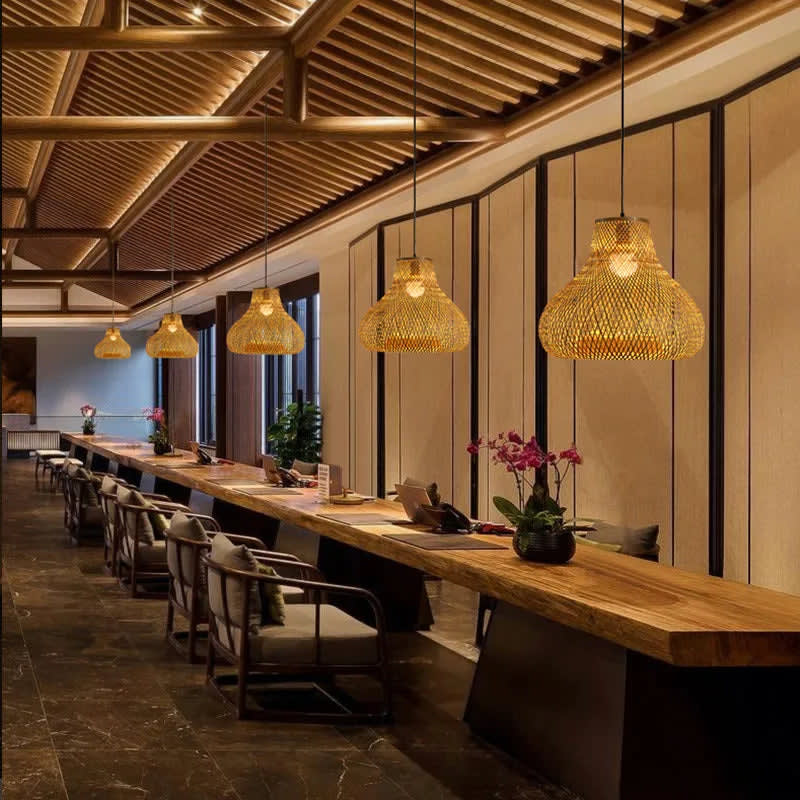 Handcrafted Bamboo Cage Pendant Light — hanging over a dining table