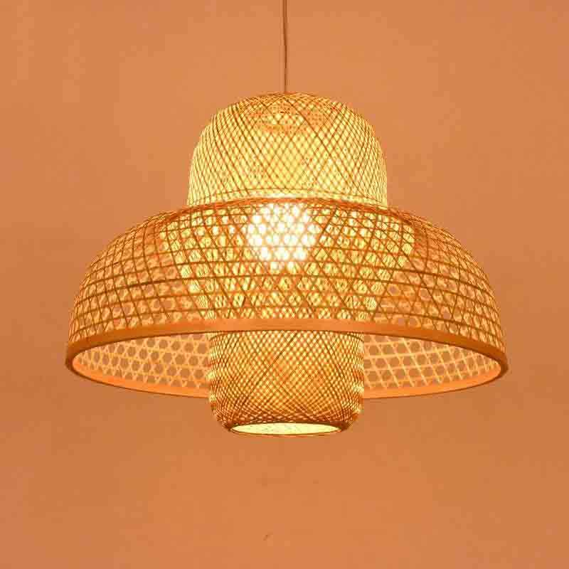Woven Bamboo Dome Pendant — hanging over a dining table