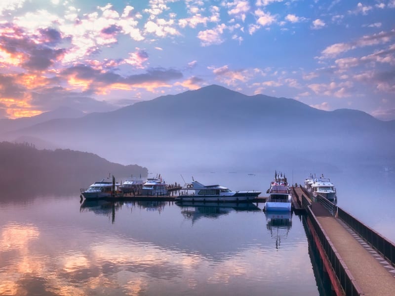 Glide across the still waters of Sun Moon Lake, Taiwan’s largest alpine lake, surrounded by misty peaks and a centuries-old tea-growing landscape.