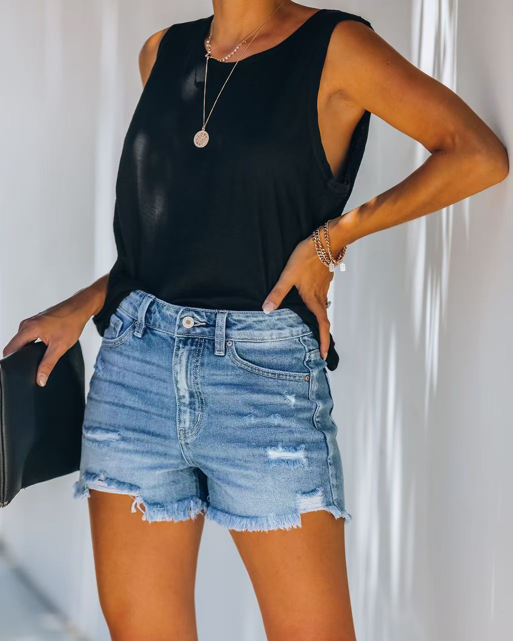 Women's Light Wash Distressed Denim Shorts — Frayed Raw Hem, Mid-Rise, view 7