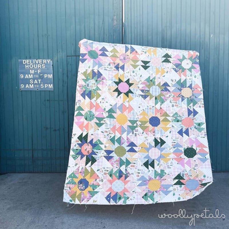 Woollypetals Stargeese Quilt with star blocks and flying geese in pastels