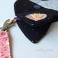 Woollypetals Cat Pouch in black fabric with colorful fish appliqué and keychain
