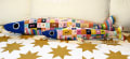 Woollypetals Sardine Pillow with colorful patchwork fabric and blue star details