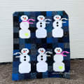 Woollypetals Do You Want to Sew a Snowman quilt showing fabric placement guide with labeled materials