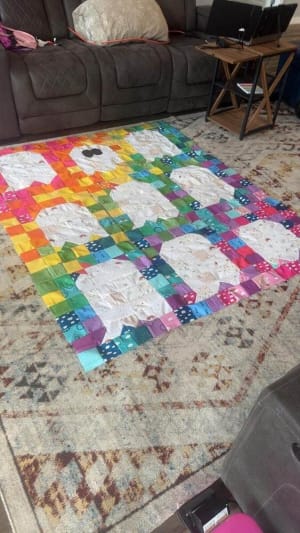 Woollypetals Ghost Party quilt with colorful rainbow and white ghost blocks