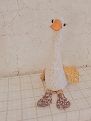 Woollypetals Silly Goose stuffed plush with white textured body, orange beak, and sparkly feet