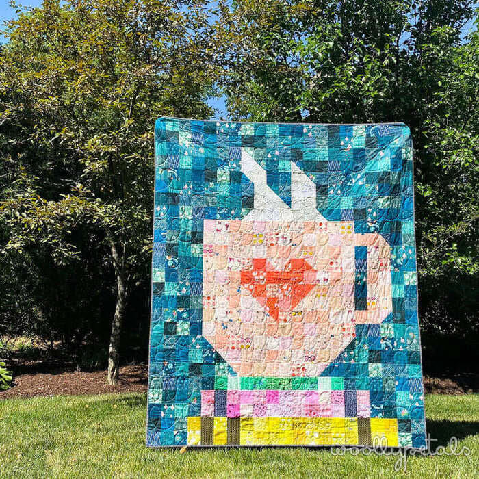 Woollypetals Book Date Patchwork Quilt with apple and heart design