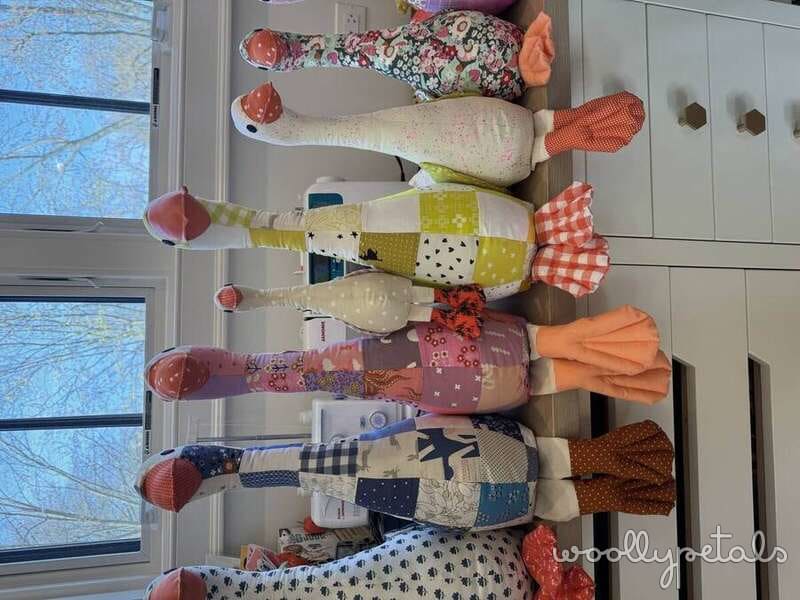 Silly Goose pattern fabric dolls lined up in a row