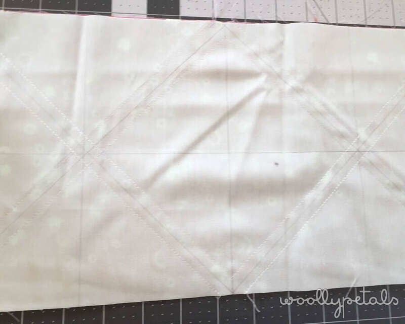 Woollypetals HST grid method tutorial showing diagonal lines drawn on fabric squares