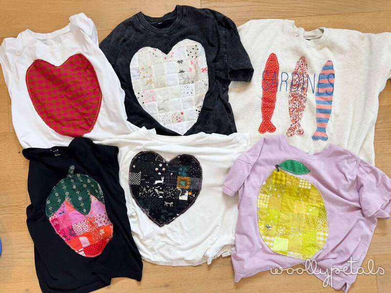 Woollypetals Quilty Shirt Tutorial designs displayed on wooden surface