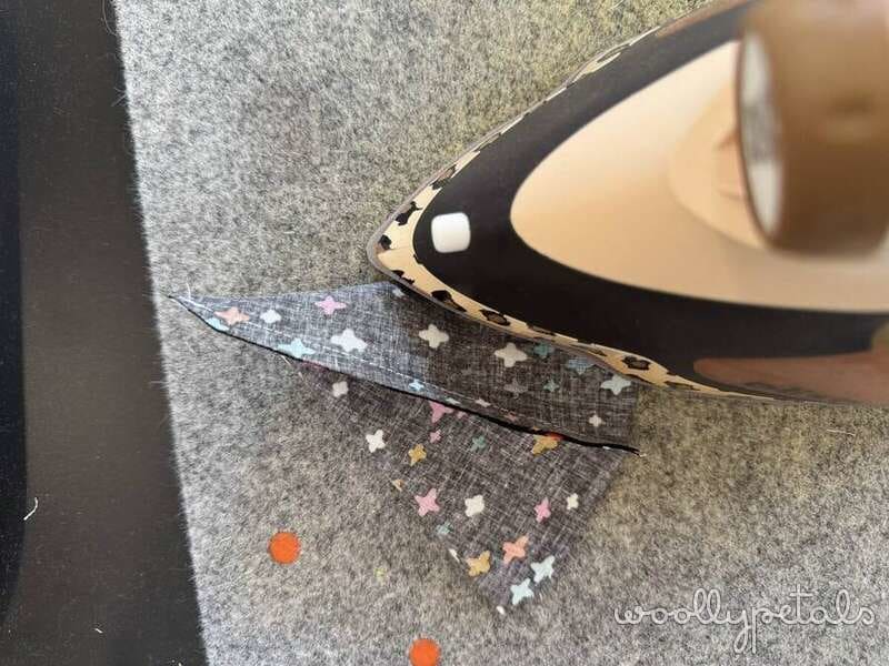 Woollypetals Silly Goose Witch Hat Tutorial with patterned fabric pieces on carpet