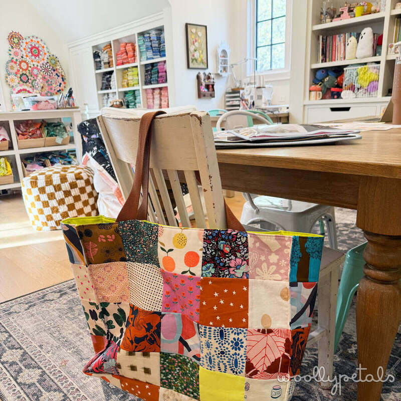 Colorful patchwork fabric basket with multicolored quilting prints