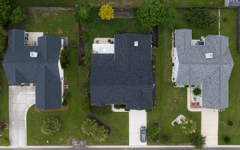 Overhead view of three homes with new roofs