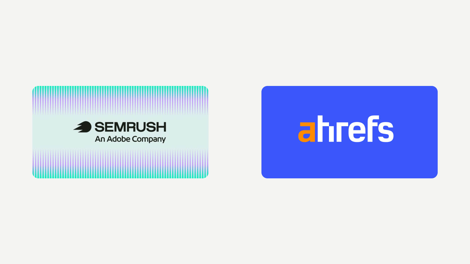 Logotipos oficiales de Semrush y Ahrefs enfrentados para comparar sus planes