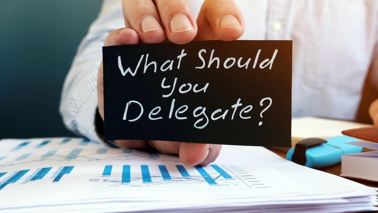 Manager delegating work to a team member