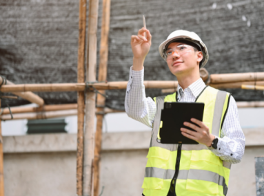 A man conducting a risk assessment inspects a construction area