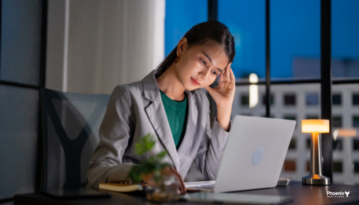 Woman working at a laptop. Workplace wellbeing matters