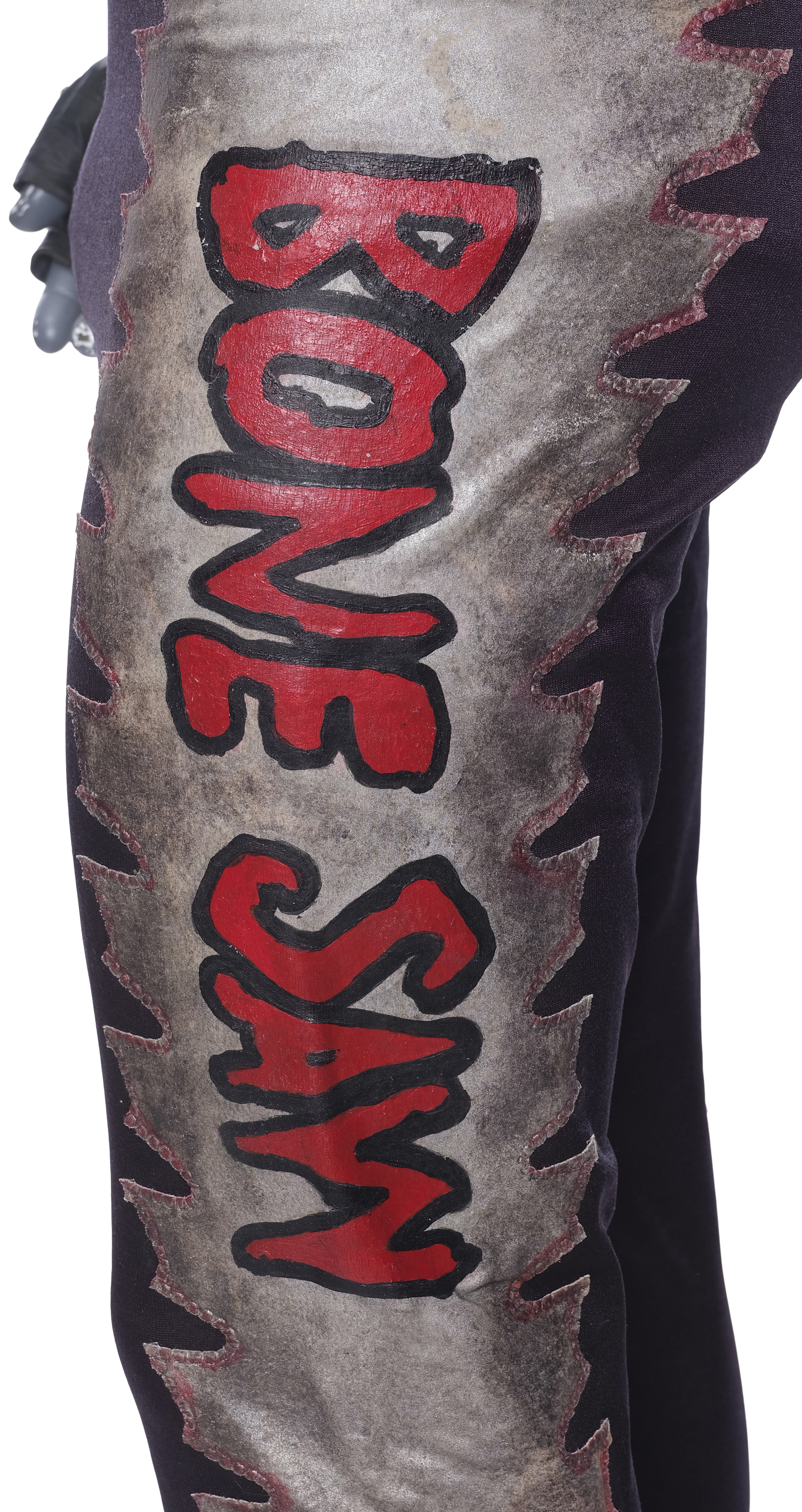 Rear view and back-detail of the Bone Saw McGraw screen-matched ensemble from Spider-Man (2002) emphasizing construction, seams, and back tailoring worn by Randy "Macho Man" Savage