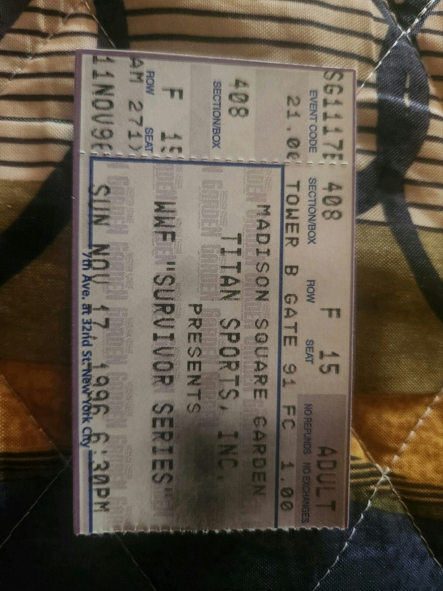 Front close-up of original 1996 WWE Survivor Series ticket stub for The Rock (Rocky Maivia) first professional match showing event branding and printed match details — rare vintage wrestling collectible