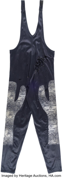 Angled alternate view showing front panel, elastic waistband and in-ring wear patterns on Cactus Jack match-worn tights from the 1992–95 King of the Death Match archive