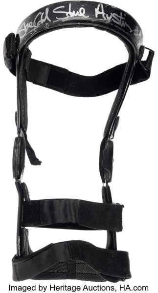 Main front view of 1998 Stone Cold Steve Austin match‑worn and signed knee brace showing full brace profile, Austin autograph and match wear from his historic 1998 run