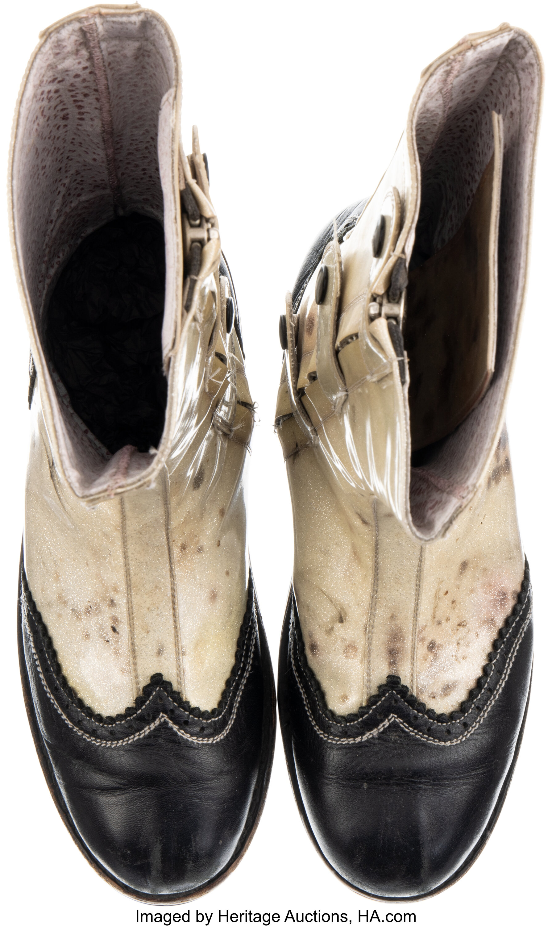Rear heel detail of Bray Wyatt match-worn and signed boots showing back stitching, wear patterns and provenance marks from his early career in NXT and WWE