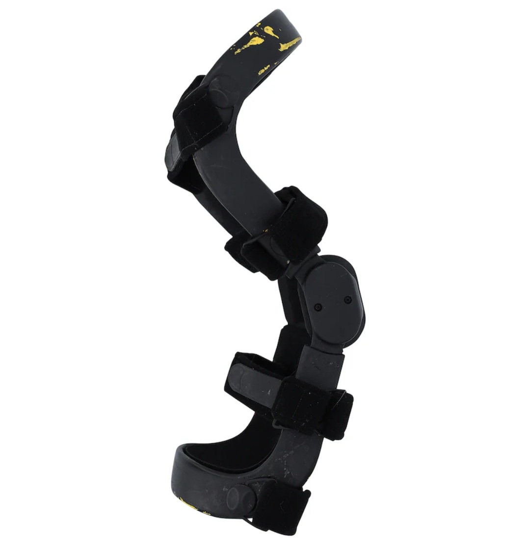 Rear view showing back strap and closure details of authentic event-worn Stone Cold Steve Austin WrestleMania 38 right knee brace