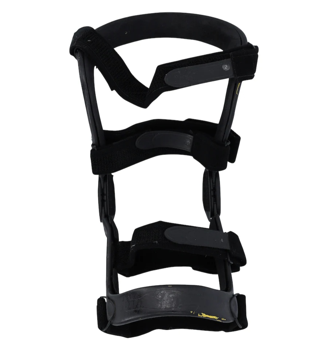 Close up of padding and interior lining of authentic event-worn Stone Cold Steve Austin WrestleMania 38 right knee brace showing wear marks