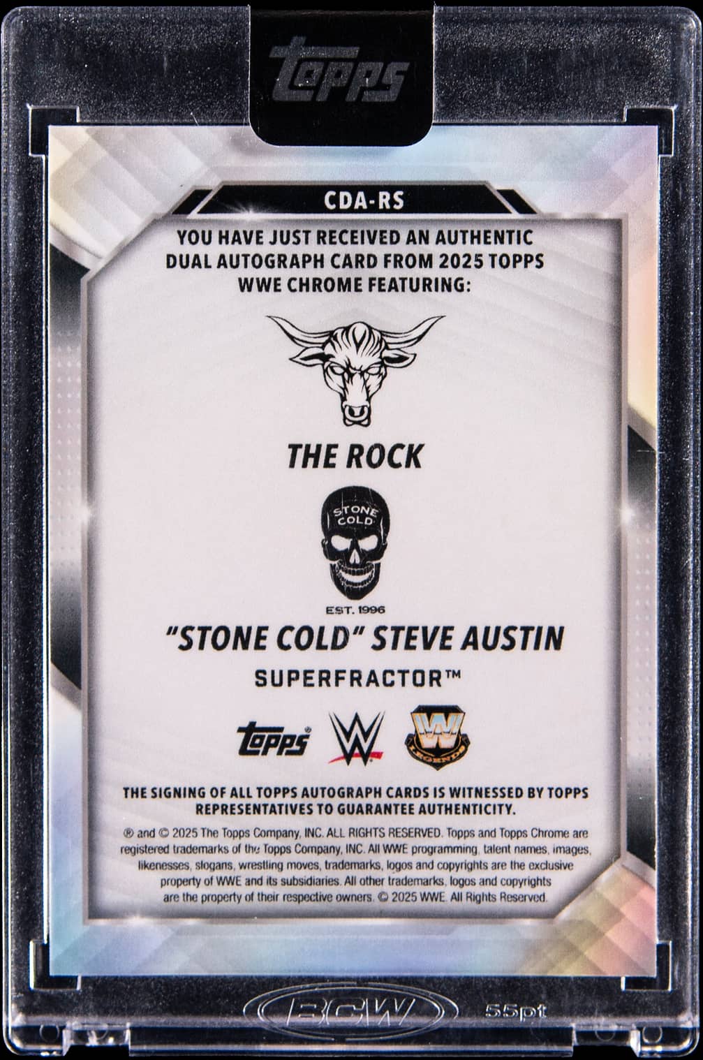 Angled alternate view highlighting the SuperFractor rainbow chromium finish and #CDA-RS set designation with both The Rock and Stone Cold Steve Austin autographs visible in Topps Encased protective case