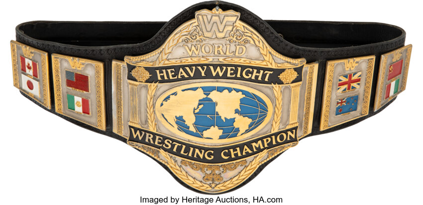 Main front view of 1986 Hulk Hogan WWF Heavyweight Championship Belt gifted by Hulk Hogan to a family friend photo matched to WrestleMania II showing gold center plate WWF logo and period patina