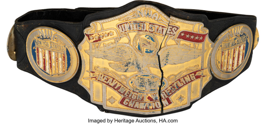 Main front view of 1980s–90s NWA United States Heavyweight Championship title belt on original leather strap showing full center and side plates, iconic 1980s–90s era piece famously destroyed by Nikita Koloff on TV and recently discovered