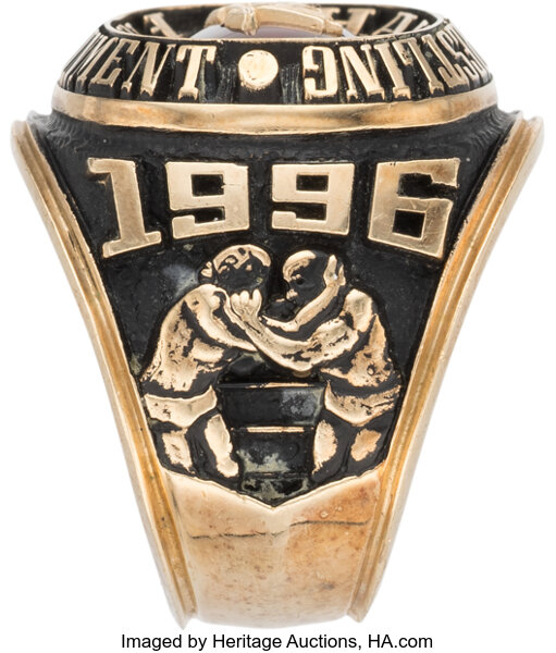 Close-up view of the 1996 Pat Patterson original WWF Hall of Fame ring face capturing surface texture and fine detail