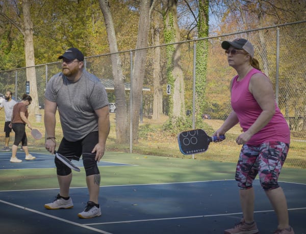 Mixed doubles team in ready position at a Bouncecraft league match