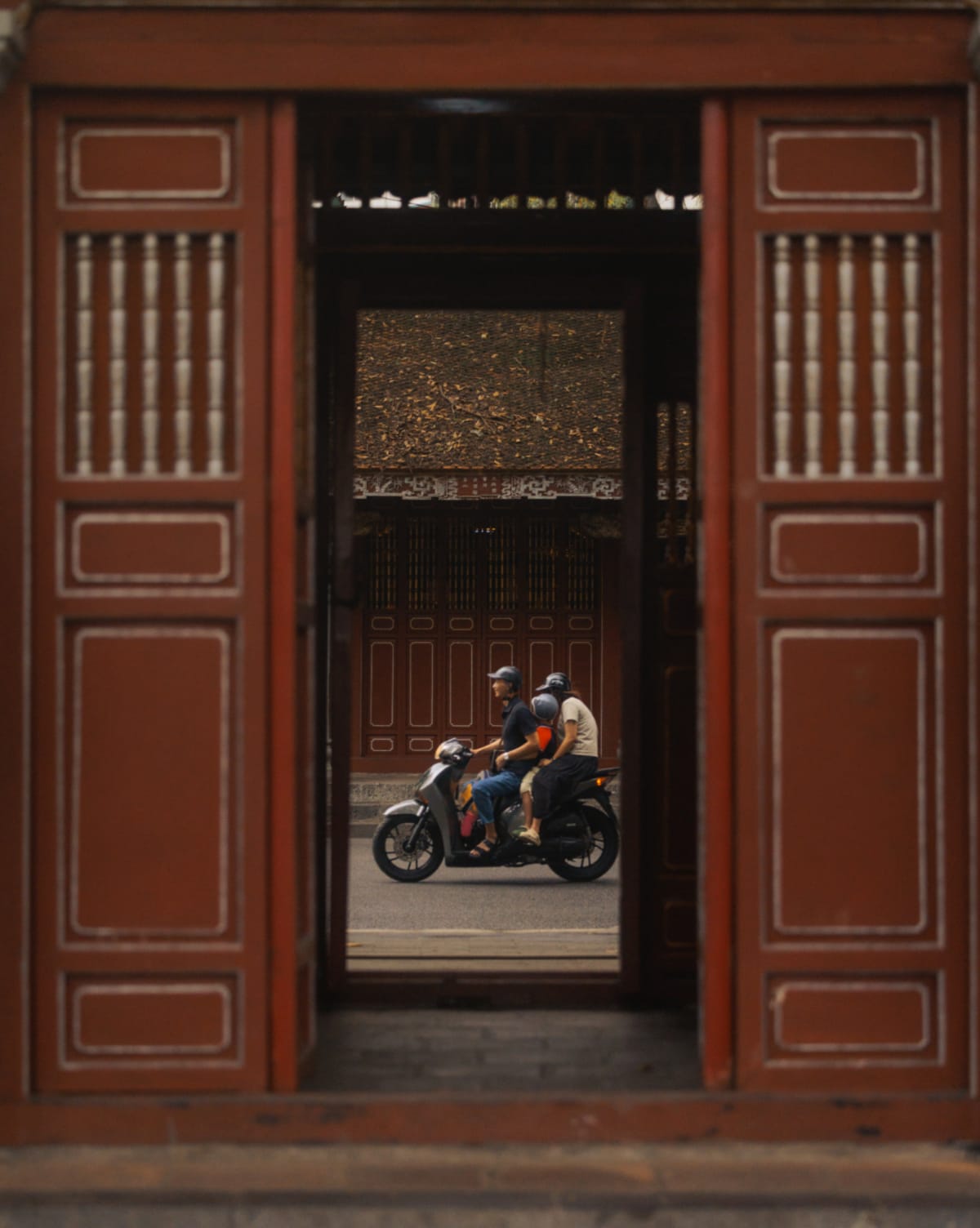 motorbike through red doors — Jimmy Ky