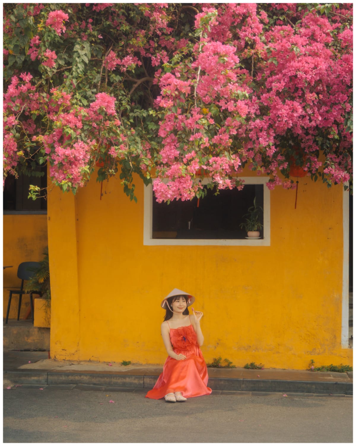 red dress bougainvillea yellow wall — Jimmy Ky