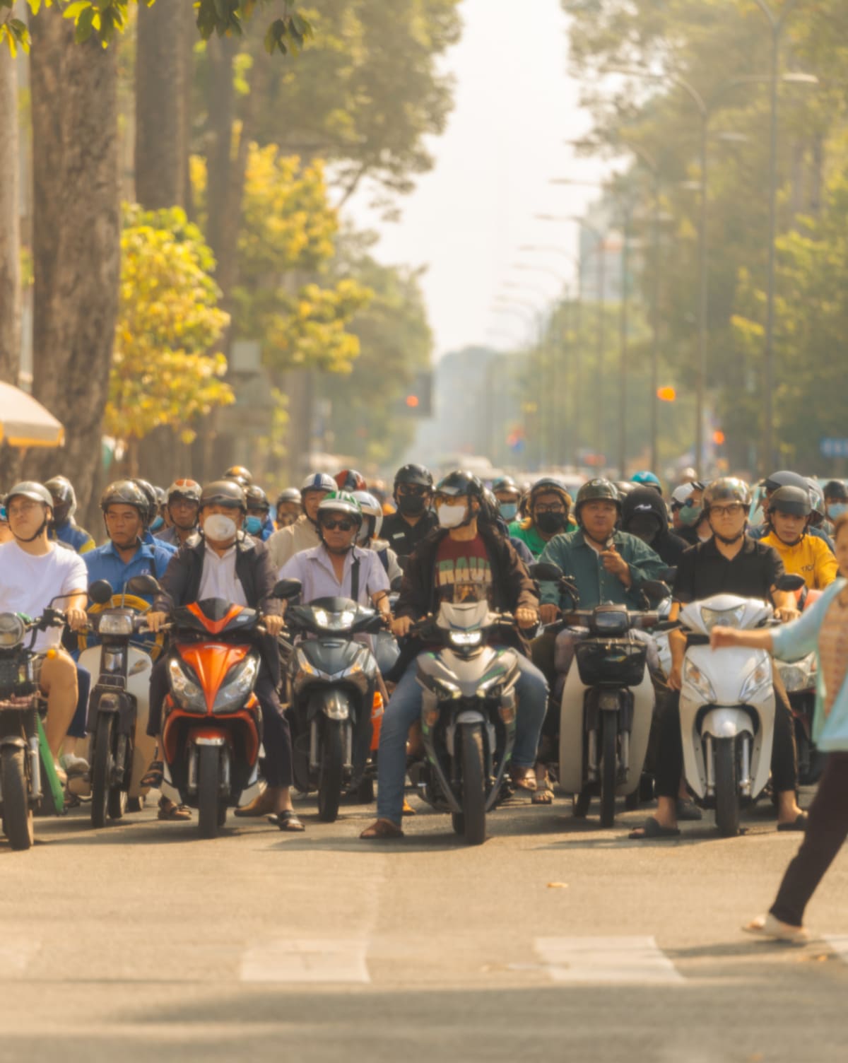 wall of motorbikes at crossing — Jimmy Ky
